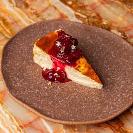 Cheesecake with cranberry compote — Creamy baked cheesecake topped with homemade cranberry compote. Sweet, smooth, and slightly tangy.