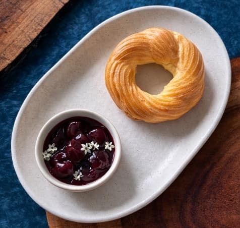 Curd ring with cherry compote — Delicate curd ring filled with silky mascarpone cream and served with rich cherry compote. Light, cr