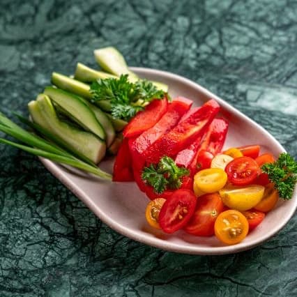 Fresh veggies — A refreshing selection of cucumber, cherry tomatoes, and bell pepper. Light, crisp, and healthy.