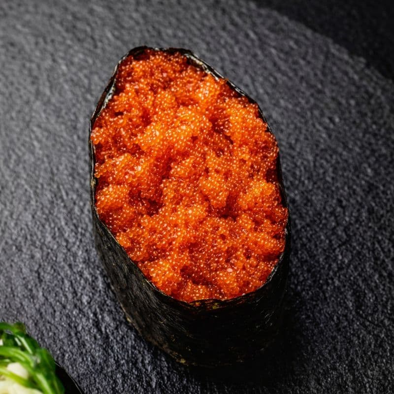 Gunkan Tobiko — A rice and nori boat with tobiko roe