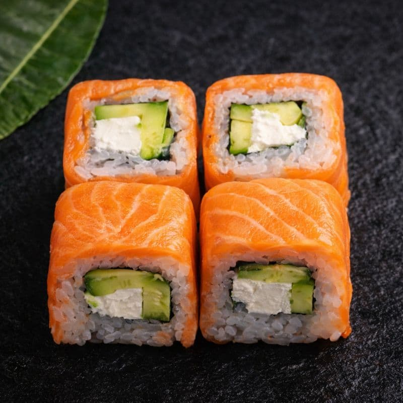 Philadelphia Uramaki 4 pcs — A roll with salmon, cream cheese, and avocado for a rich flavor