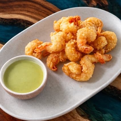 Shrimps wasabi — Crispy fried shrimp served with creamy wasabi sauce. Lightly spicy, crunchy, and flavorful.
