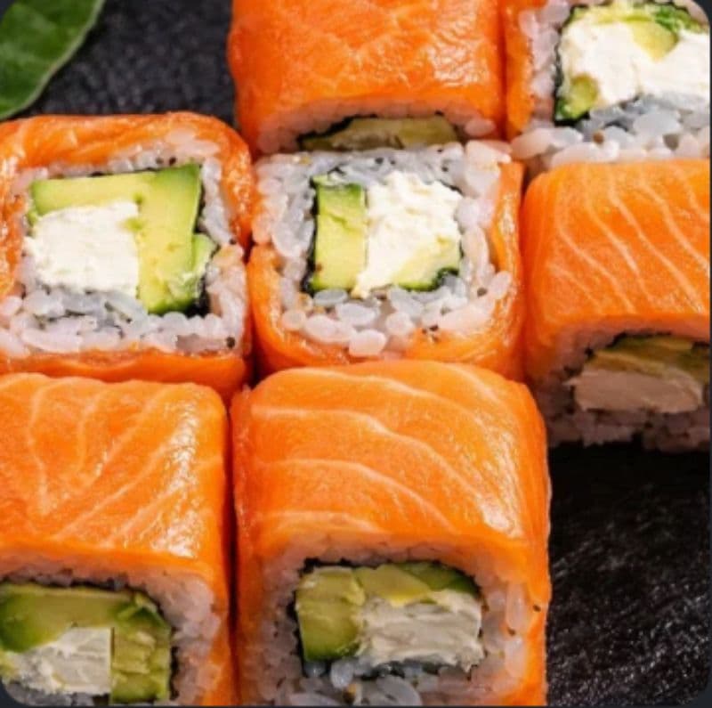 Spicy Philadelphia Uramaki — A roll with salmon, cream cheese, and avocado for a rich flavor