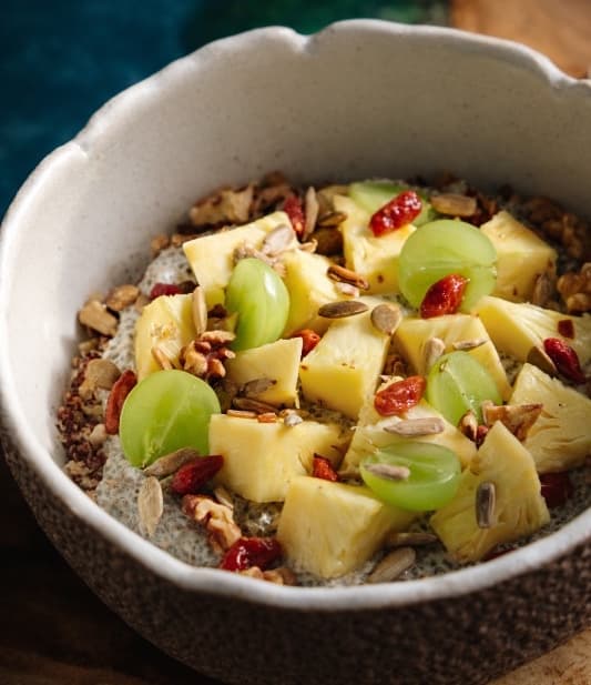 Superfood bowl with chia and fruits — A refreshing bowl with quinoa, chia seeds, Greek yogurt, fresh fruits, walnuts, and mixed seeds. Nat