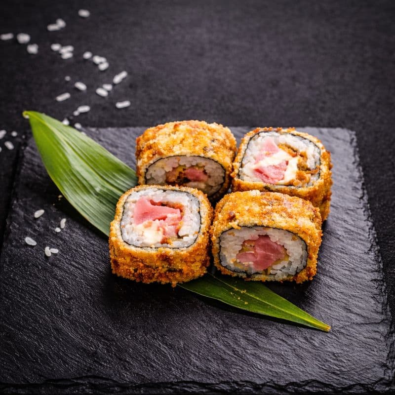 Tempura Kani Maki 4 pcs — A roll with shrimps, cream cheese, red tobiko - wrapped and fried in golden tempura