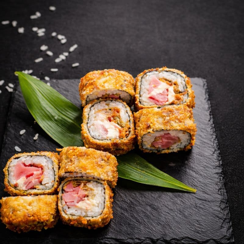 Tempura Kani Maki 8 pcs — A roll with shrimps, cream cheese, red tobiko - wrapped and fried in golden tempura
