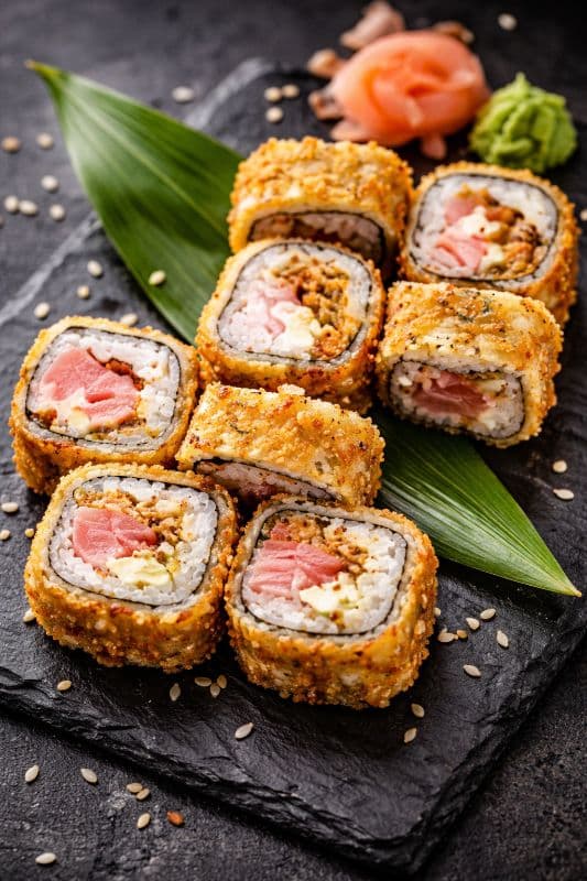 Tempura Tekka Maki — A roll with tuna and cucumbers, wrapped and fried in golden tempura