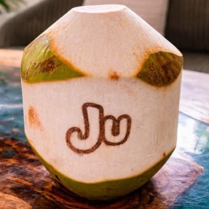 Young Coconut — Fresh young coconut served chilled straight from the shell. Naturally hydrating with delicate tropic